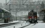 SBB Re 4/4 II with an Interregio by a strong winter weather on the way to Brig. 
17.12.2008