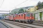 The Swiss mercenary tradition continues: SBB 11285 in CrossRail-service stands at Spiez on a grey 14 May 2010.