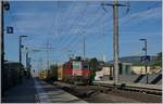 The SBB Re 4/4 II 11214 with mail-train in Biel Bözingerfeld.