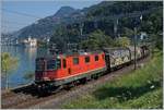 The SBB Re 420 327-9 with a Cargo train by Villeneuve with the Castle of Chillon in the background.