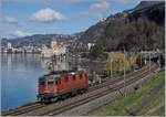 The SBB Re 420 290-9 on the way to Lausanne by the Castle of Chillon.
