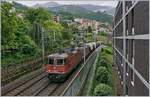 The SBB Re 4/4 II 11275 and an other one with the  Spaghetti -Cargo from Italie to French here to see in Montreux.