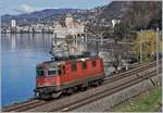 The SBB Re 4/4 II 11290 (Re 420 290-9) near the Castle of Chillon on the way to Lausanne. 

04.03.2020