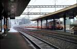 Re 4/4 Swiss Express is driving through Lenzburg, October 14th, 1983.