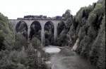 Re 4/4 II with train at Sitten-bridge near to St. Gallen, May 16th, 1982.