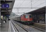 The SBB Re 420 244-6 on the end of a Cargo train by a heavy rain in Bellinzona.