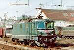 The SBB Re 4/4 11238 was still seen in Lausanne in the traditional green, but with an interesting visual enhancement on the front end of the locomotive.

Analog photo from March 1994