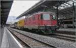 The two SBB Re 4/4 II 11136 (Vevey side and barely visible here) and the Re 4/4 11196 (Geneva side) are standing in Lausanne with a test train on track 2. 

June 27, 2025