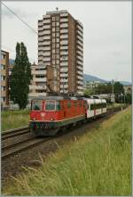 SBB Re 4/4 II 11211 with an Domino ABt by Grenchen.