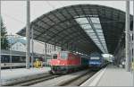 Re 4/4 II with an IR to Basel SBB by the stop in Olten.
25.06.2011