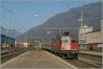 The SBB Re 4/4 II 11303 with his IR to Locarno is approaching Giubiasco. 
23.03.2011