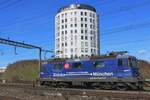 Ex-SBB 421 379 passes the characteristic Clariant building at Pratteln on 13 February 2024