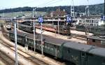 Spiez overview of station with Re 4/4 (SBB), part of Ae 6/8, Re 4/4 (BLS) and electric multiple unit ABDe 4/8 (BLS); July 27th, 1980.