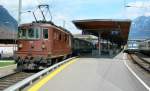 BLS Re 4/4 181 with a RE to Zweisimmen waits the departure in Interlaken ost.