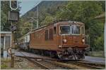 The BLS Re 4/4 161 (Ae 4/4 II till 1969) with his EC  Thunersee  is arriving at Interlaken Ost.

analog picture / summer 1987