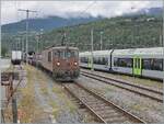 El BLS Re 4/4 195 llega a su destino Brig con un tren de coches de túnel procedente de Iselle.

12 de septiembre de 2024