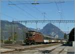 BLS Re 4/4 163  Grenchen  with a Golden Pass RE in Leissigen.
09.04.2011