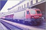 The SBB Re 4/4 IV 10102  Luino  is waiting with an IC to Genève in Domodossola for departure.

Analog photo from May 1985
