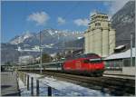 The Re 460 071-4 with an IR to Brig is leaving Aigle.