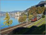 The SBB Re 460 039-1 with an IR to Brig near the Castle of Chillon.