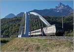 In the mornig Sun: The SBB Re 460 011-7 with an IR on the new Massogex Bridge between St Maurice and Bex. 11.10.2017