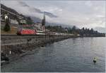 The SBB Re 460 020-1 with an IR from Brig to Geneva near Villeneuve.