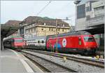 The SBB Re 460 058-1  100 years Circus Knie  with his IC1 713 in Lausanne.