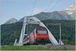 A SBB Re 460 with an IR 90 on the way to Brig between Bex and St Maurice.