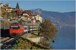 A SBB Re 460 with an IR 90 on the way to Geneve Airport by St Saphorin.