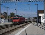 The SBB Re 460 107-6 with an IR on the way to Geneva in Coppet.