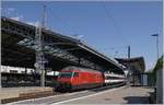 The SBB Re 460 052-4 with an IR 90 by his stop in Lausanne.