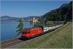 The SBB RE 460 060-7  Val de Travers  with an IR 90 on the way to Brig by the Castle of Chillon.