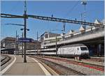 The SBB Re 460 113-4  100 years SEV  with an IR 15 to Luzern by his stop in Lausanne.