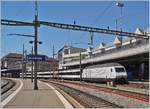 The SBB Re 460 113-4  100 years SEV  with an IR 15 to Luzern by his stop in Lausanne.