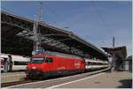 The SBB Re 460 114-2  Circus Knie  with an IR90 (Brig-Geneva Airport) by his stop in Lausanne.