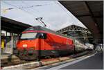The SBB Re 460 033-4 with an IC1 from St Gallen to Geneva by his stop in Lausanne.