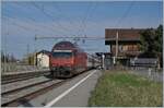 The SBB Re 460 048-2 with an IR90 on the way to Brig in Roches VD.