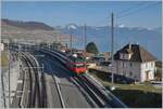 A SBB Re 460 with his IR 90 on the way to Genève Aéroport an a view over the new Cully Station.