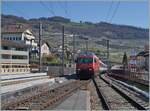 A SBB Re 460 with his IR 90 on the way to Geneva in Cully. 

01.04.2021