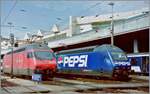 One of the early advertising locomotives was the attractive SBB Re 460 018-6 PEPSI, seen here next to the SBB Re 460 019 in Lausanne.

Analogue picture from March 1998