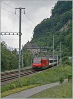 A SBB Re 460 with an IR 90 by St-Maurice on the way to Geneva Airport     14.05.2020