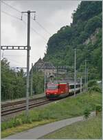 A SBB Re 460 with an IR 90 by St-Maurice on the way to Geneva Airport 

14.05.2020