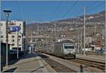 The SBB Re 460 037  LATTESSO  with his IR 90 is arriving at the Vevey station. 

16.11.2024