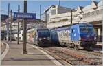 While the SBB Re 460 078  Nendaz  departs Lausanne with its IR 90 bound for Brig, the WRS Re 475 902 with its oil train had to wait for the block distance of the IR for its onward journey to St-Triphon. March 7, 2024