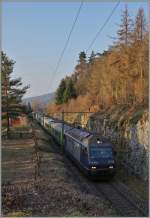 The BLS Re 465 010 with a RE from La Chaux de Fonds to Bern near Chambrelien.