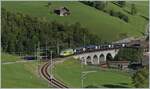 Once again the GoldenPass Express GPX 4064 from Montreux to Interlaken Ost, now supplemented by the  Interface  car and the BLS Re 465 014, while the MOB Ge 4/4 8001 is waiting in Zweisimmen for the