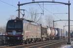 Sadly against the sunlight, but with a touch of snow at the nose: SBBCI 193 658 hauls an intermodal train to Waalhaven through Hulten on 19 January 2024.