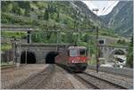 SBB Re 6/6 and Re 4/4 II are comming out of the Gotthard Tunnel.