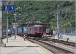 The SBB Re 620 032-3 and a Re 4/4 II are arriving wiht his cargo train in Brig.