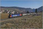 The SBB Re 6/6 11610 (Re 620 010-9)  Spreitenbach  is bringing several empty fan and train carriages as freight train 69701 from Lausanne-Triage to Le Brassus and was photographed here near Les Charbonnières with Lac de Brenet in the background.

March 24, 2022